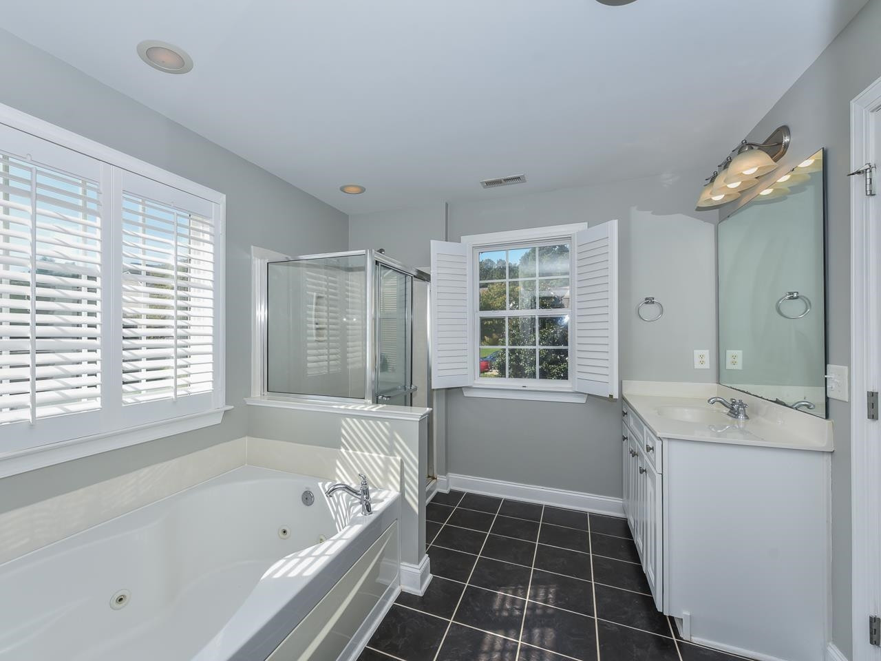200 Quarryrock Road Holly Springs, NC 27540 - Photo 26 of 39 a bathroom with a bathtub sink and window