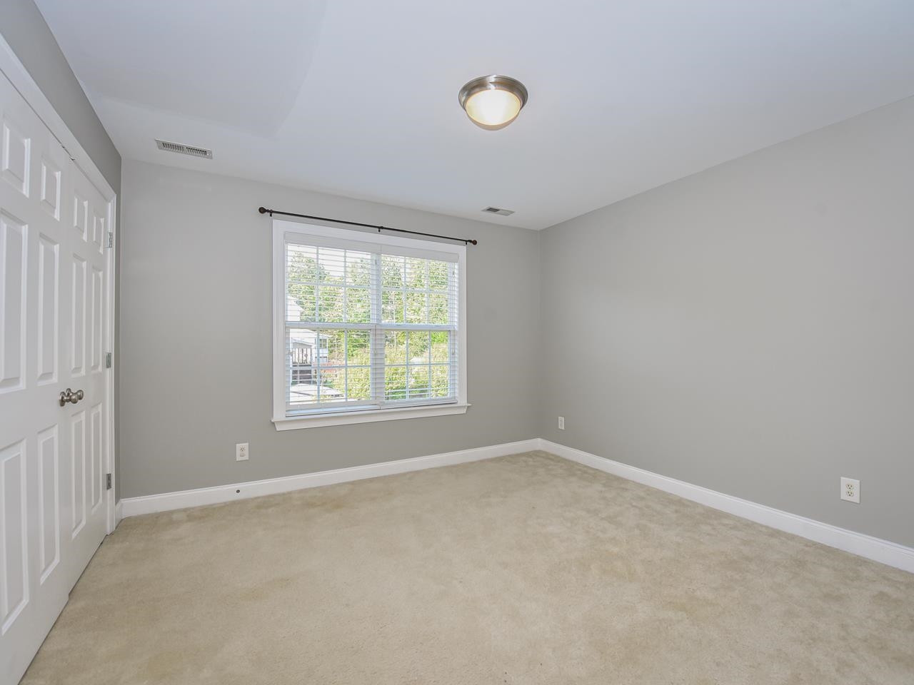 200 Quarryrock Road Holly Springs, NC 27540 - Photo 29 of 39 an empty room with windows