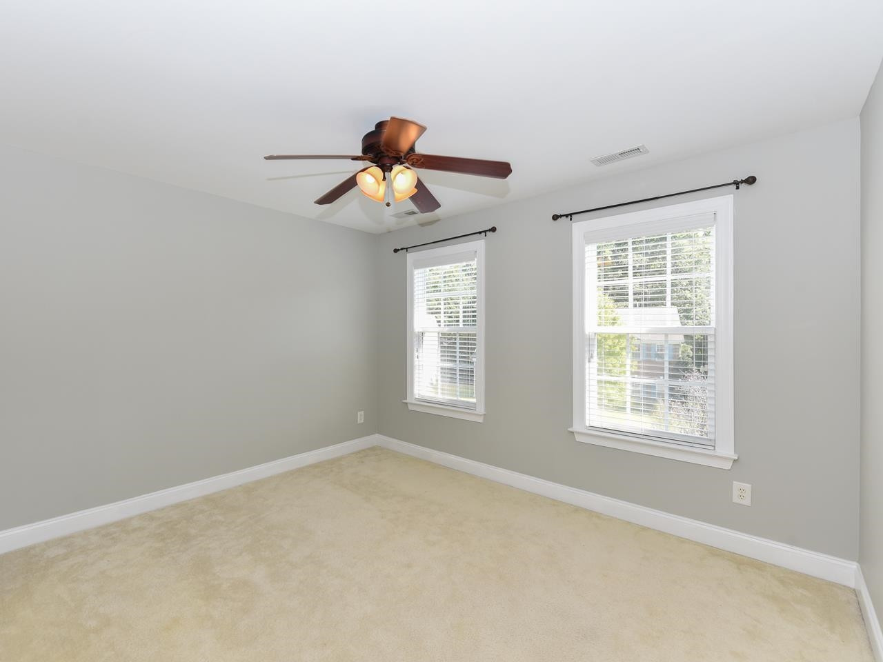 200 Quarryrock Road Holly Springs, NC 27540 - Photo 31 of 39 a view of a room with a window and a ceiling fan