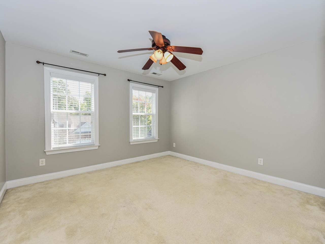 200 Quarryrock Road Holly Springs, NC 27540 - Photo 32 of 39 an empty room with windows and fan