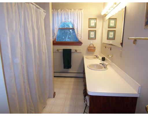 11 Georgianna Road Billerica, MA 01821 - Photo 15 of 29 a bathroom with a sink toilet and shower