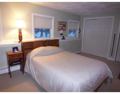 11 Georgianna Road Billerica, MA 01821 - Photo 29 of 29 a bedroom with a bed and a lamp