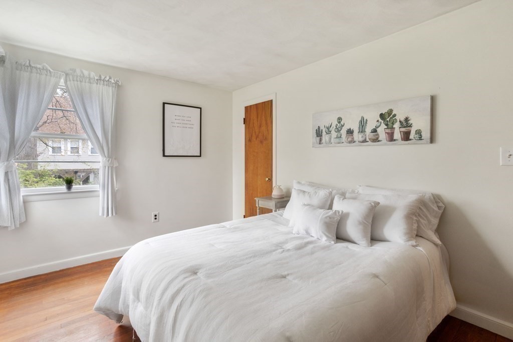 19 Laconia Road Natick, MA 01760 - Photo 12 of 27 a bedroom with a bed and a window