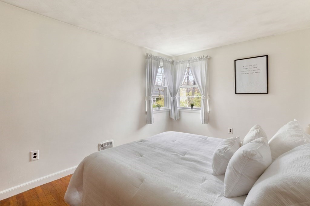 19 Laconia Road Natick, MA 01760 - Photo 13 of 27 a bedroom with a bed and a window