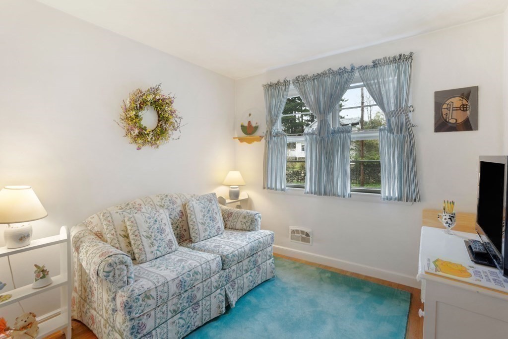 19 Laconia Road Natick, MA 01760 - Photo 17 of 27 a living room with furniture and a flat screen tv