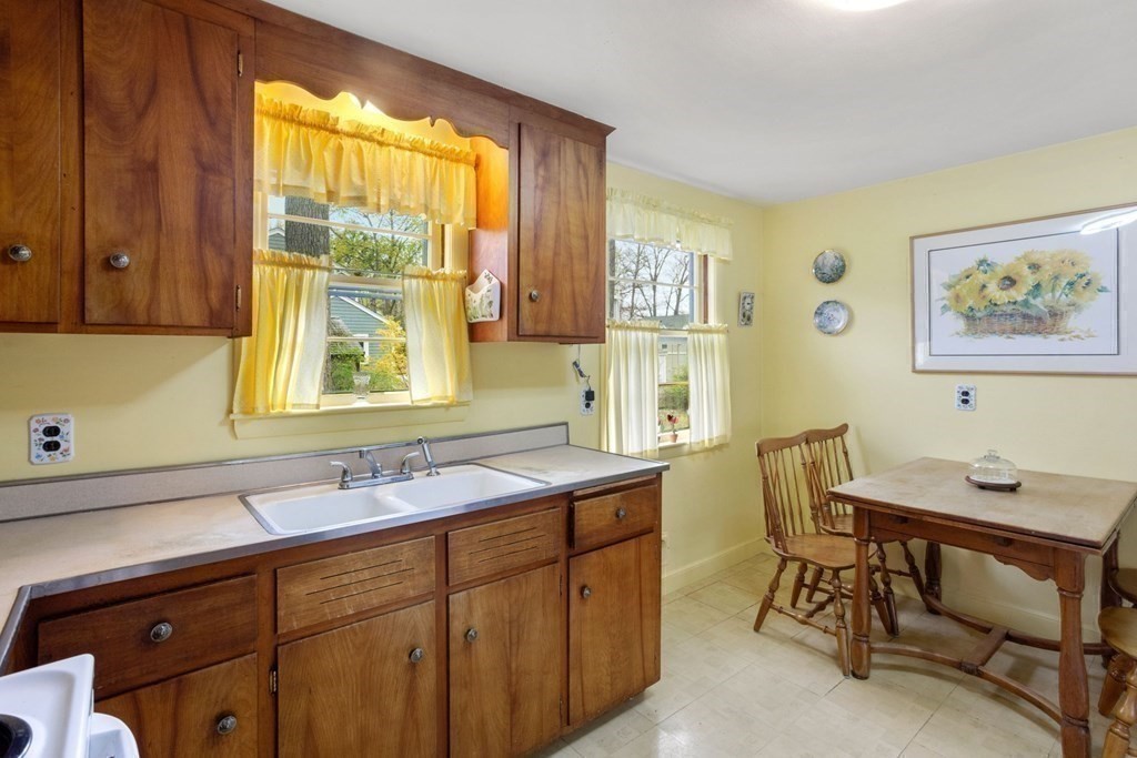 19 Laconia Road Natick, MA 01760 - Photo 9 of 27 a view of a kitchen area with furniture and window