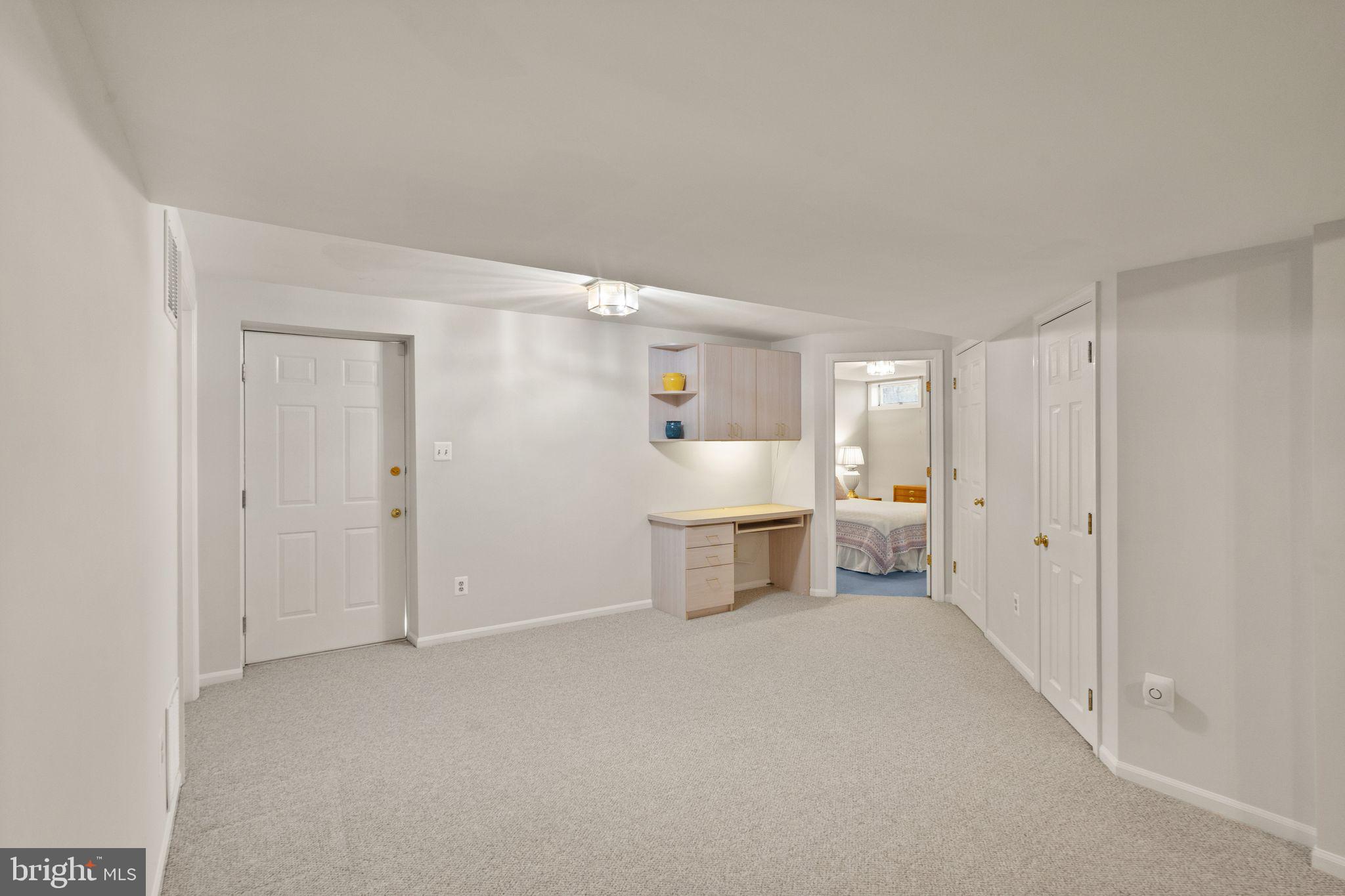 14735 Pickets Post Road Centreville, VA 20121 - Photo 45 of 69 Basement area with built-in workspace.