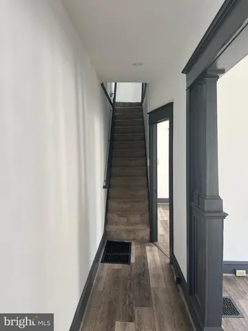 a view of entryway with wooden floor