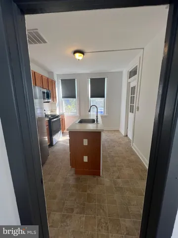a kitchen with a stove microwave and refrigerator