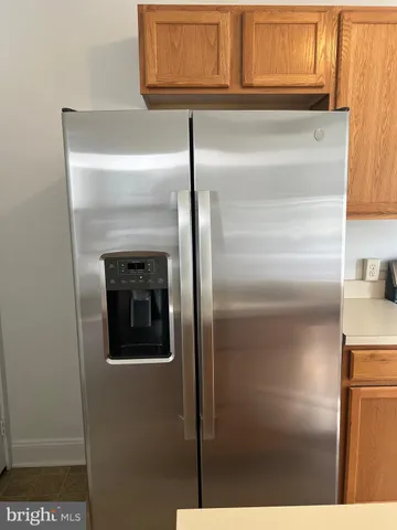 a room with sink cabinets and rug