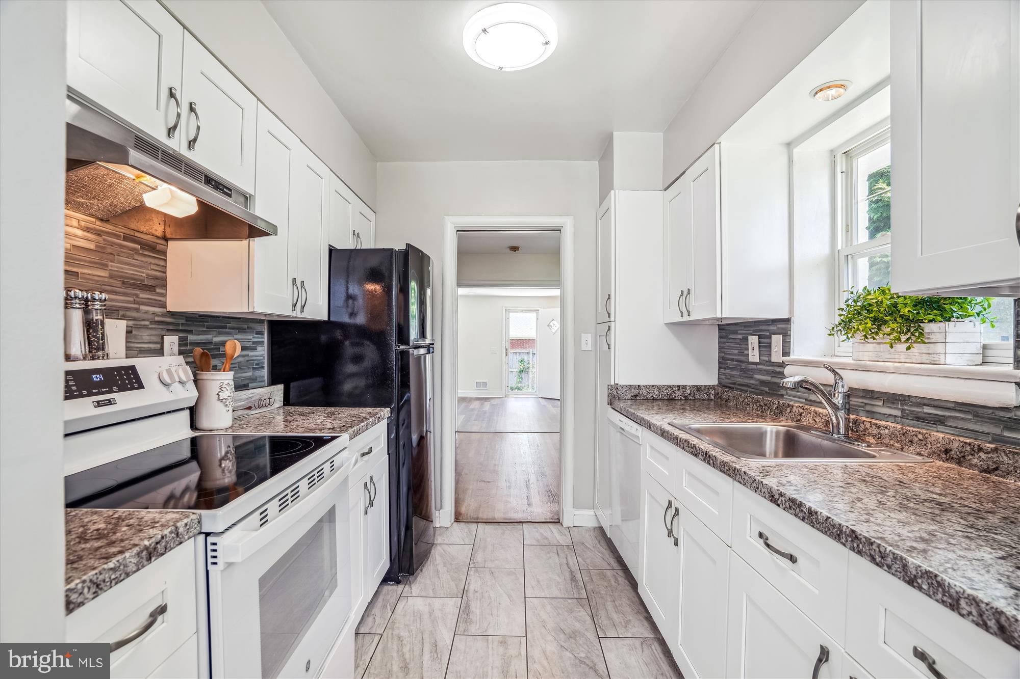 9711 Saxony Road Silver Spring, MD 20910 - Photo 11 of 32 TS Kitchen w side door exit