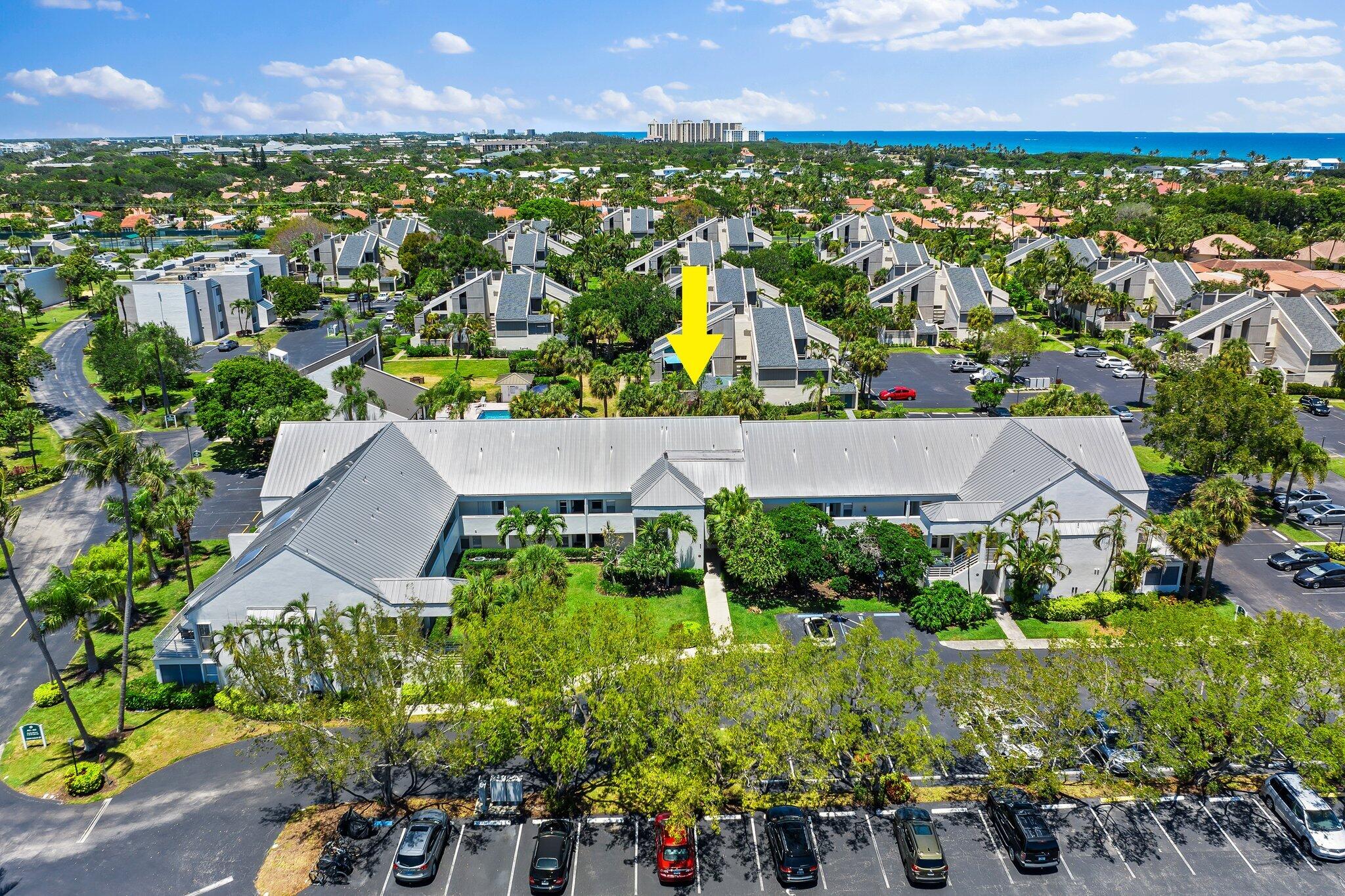 1605 Highway 1, Unit 209M2 Jupiter, FL 33477 - Photo 25 of 26 an aerial view of residential houses with outdoor space and trees