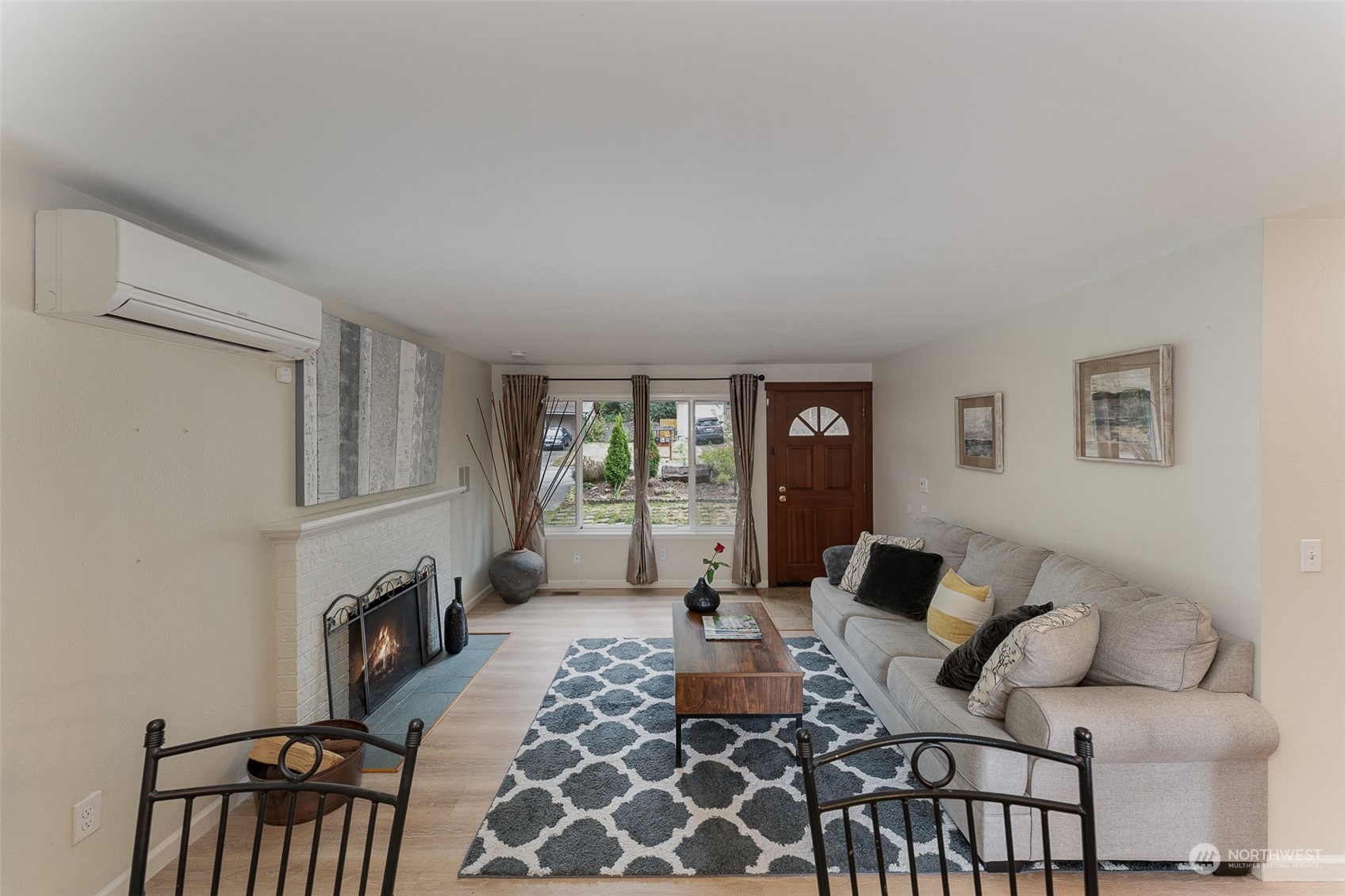 20323 12th Drive Southeast Bothell, WA 98012 - Photo 2 of 10 a living room with furniture and a fireplace