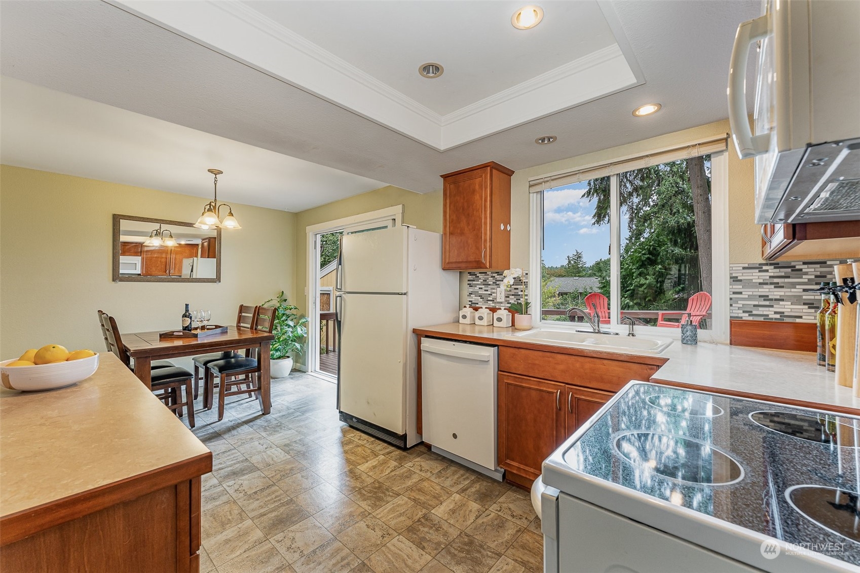 20323 12th Drive Southeast Bothell, WA 98012 - Photo 4 of 10 a kitchen with furniture a large window and stainless steel appliances