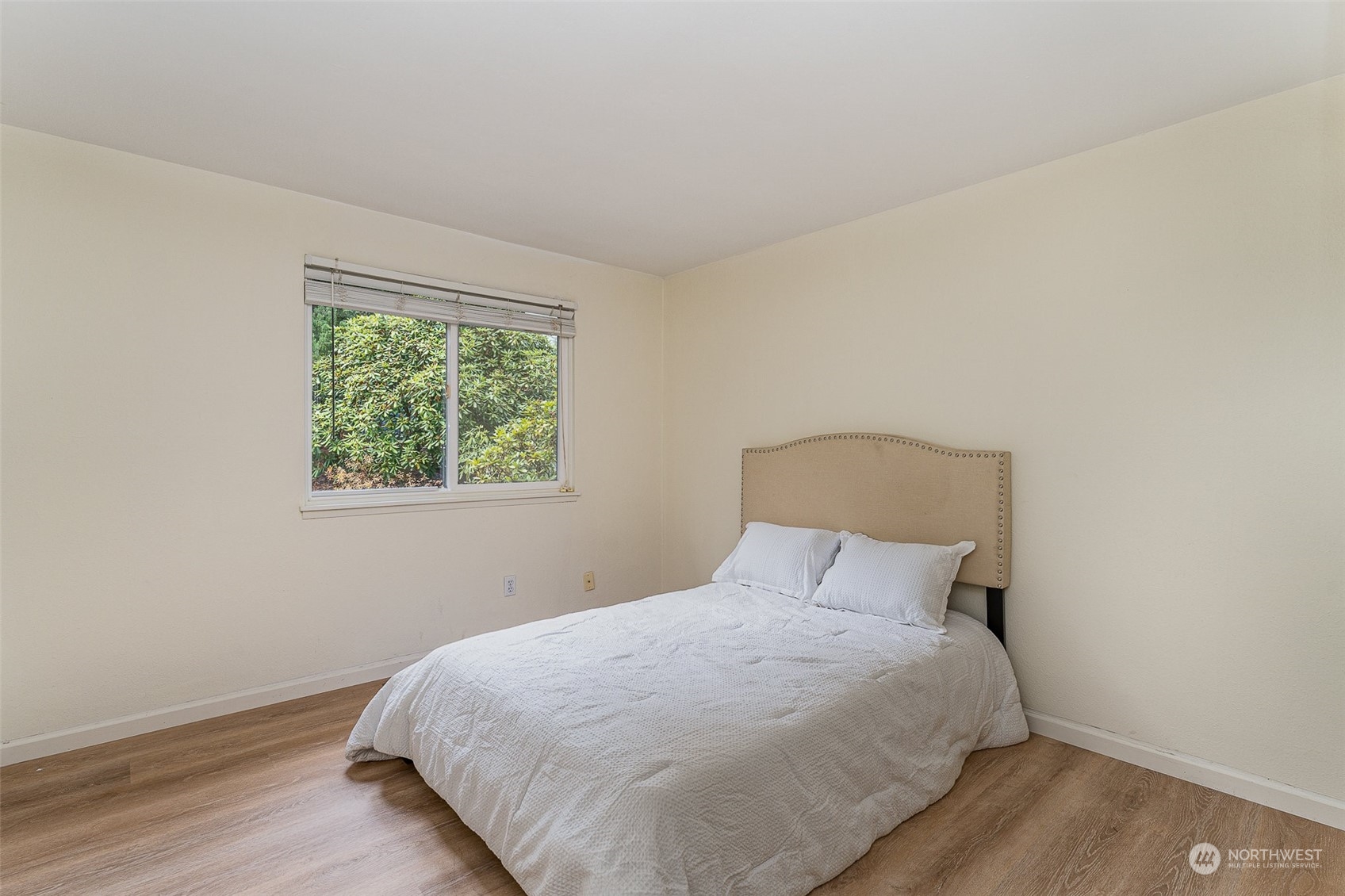20323 12th Drive Southeast Bothell, WA 98012 - Photo 5 of 10 a bedroom with a bed and a window