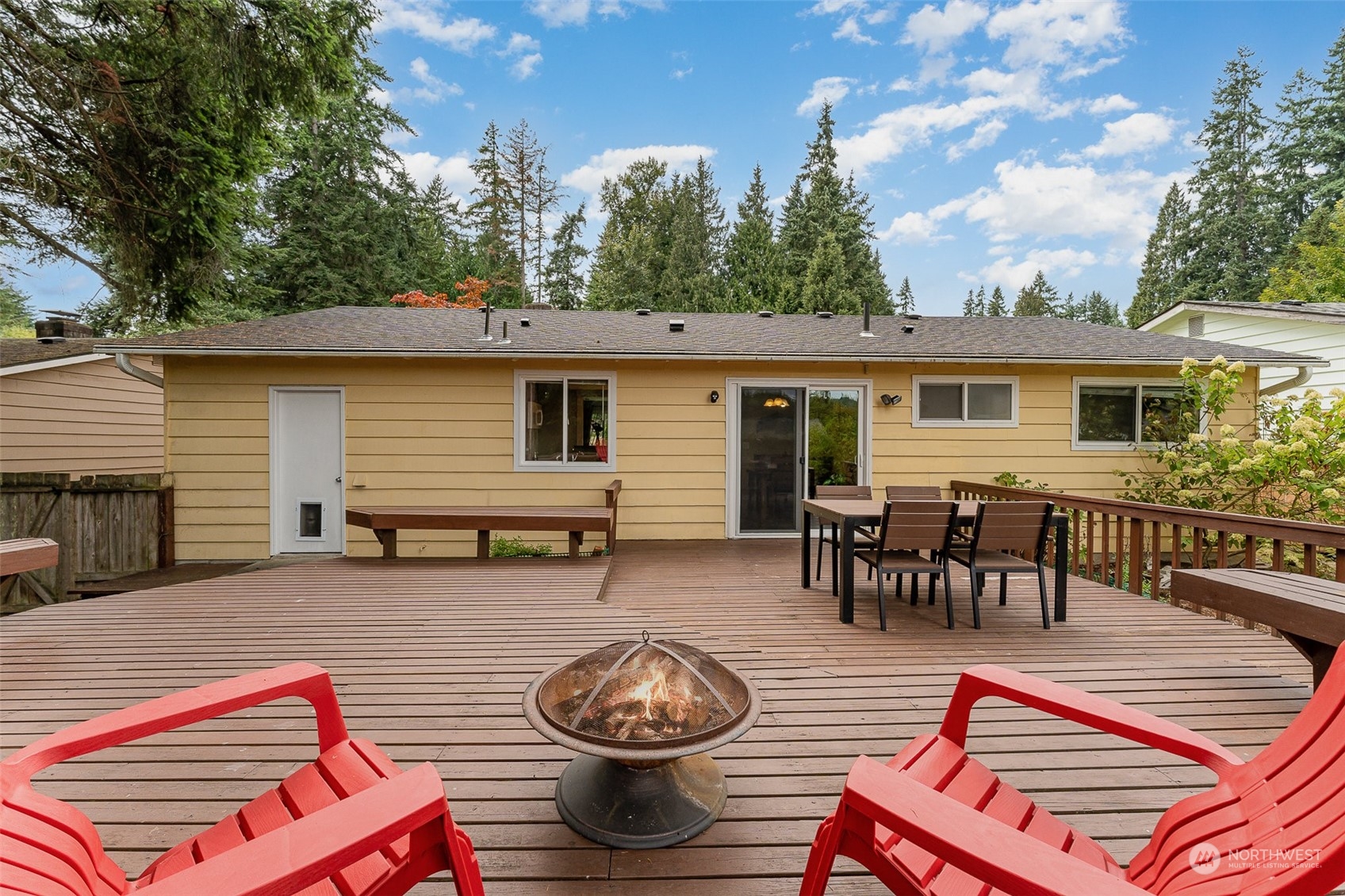 20323 12th Drive Southeast Bothell, WA 98012 - Photo 10 of 10 a backyard of a house with barbeque oven table and chairs