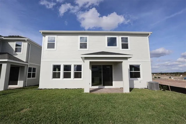 a view of a back yard of the house