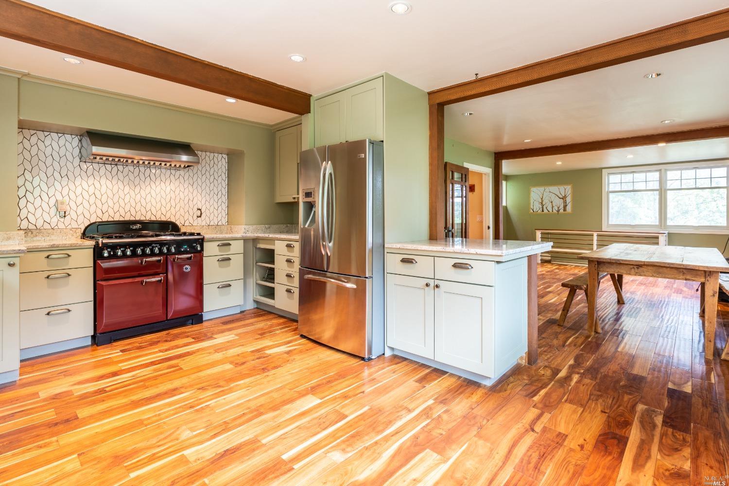 58 Madrone Park Circle Mill Valley, CA 94941 - Photo 1 of 1 a kitchen with granite countertop a stove cabinets and stainless steel appliances