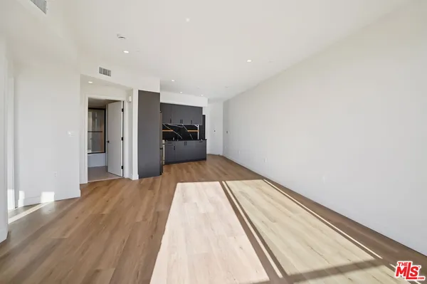 a view of a living room with a bed