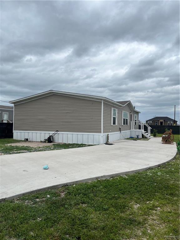 210 Risueno Avenue Donna, TX 78537 - Photo 2 of 32 a backyard of a house