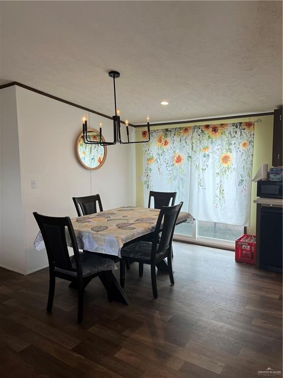 210 Risueno Avenue Donna, TX 78537 - Photo 21 of 32 a view of a dining room with furniture window and wooden floor