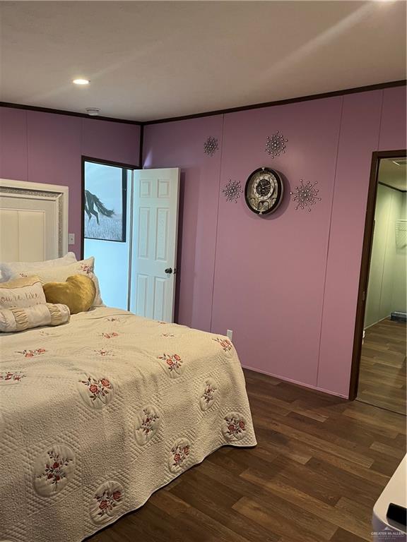 210 Risueno Avenue Donna, TX 78537 - Photo 25 of 32 a bedroom with a bed and a dresser