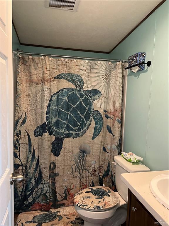 210 Risueno Avenue Donna, TX 78537 - Photo 30 of 32 a bathroom with a sink toilet and shower