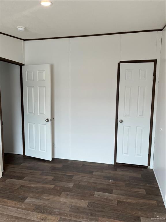 210 Risueno Avenue Donna, TX 78537 - Photo 32 of 32 a view of an empty room with wooden floor and a window