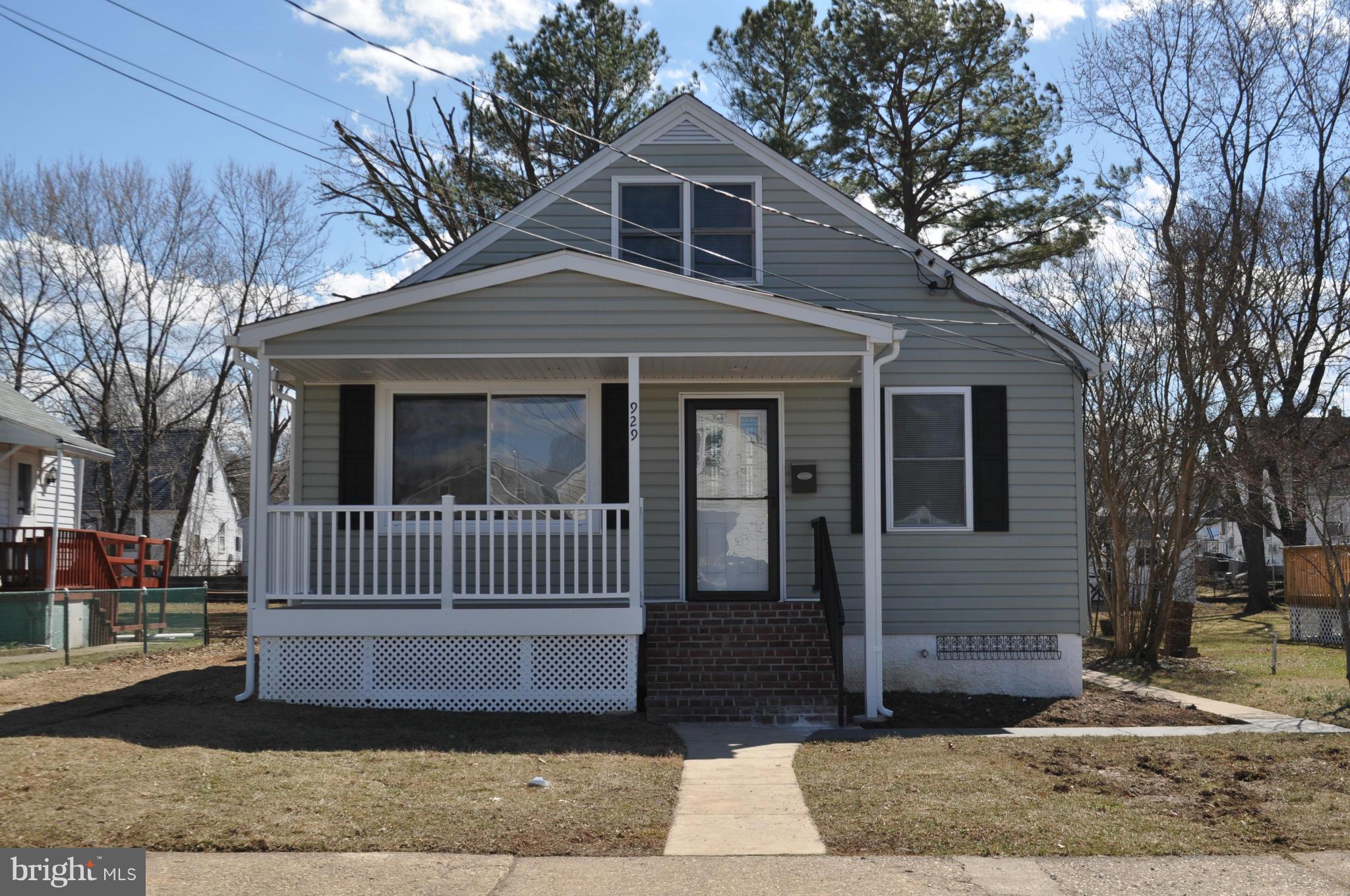 929 Woodlynn Road Baltimore, MD 21221 - Photo 1 of 25 a front view of a house with a yard
