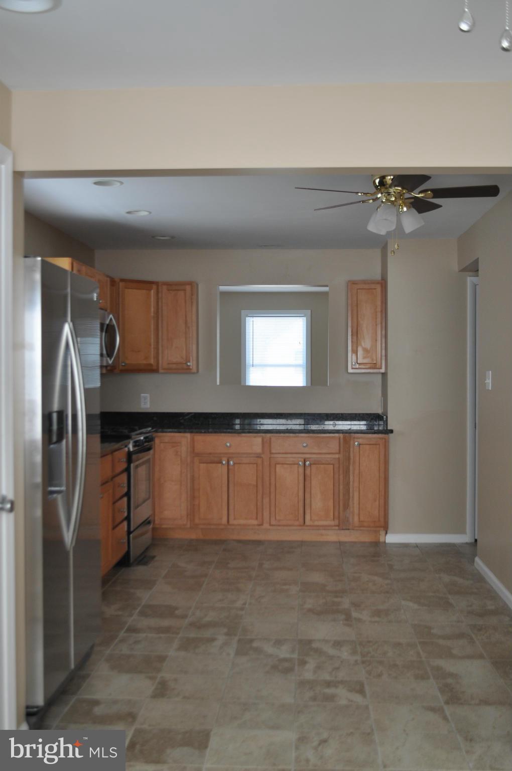 929 Woodlynn Road Baltimore, MD 21221 - Photo 6 of 25 a bathroom with a sink and a mirror