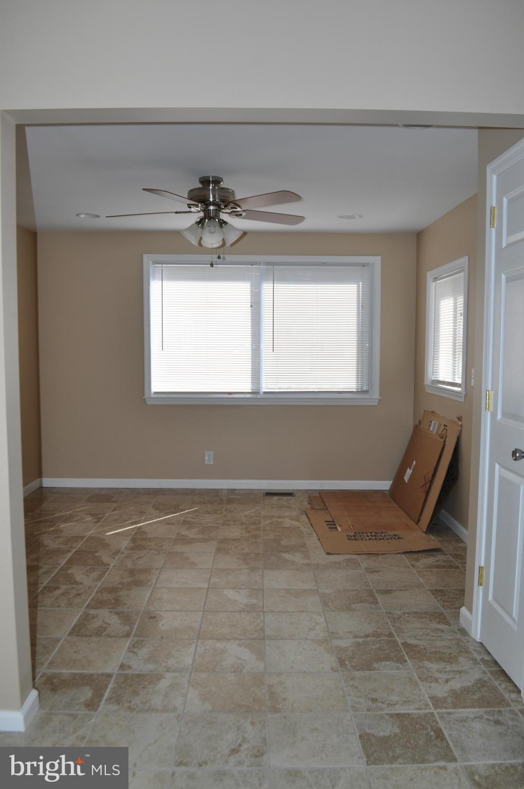 929 Woodlynn Road Baltimore, MD 21221 - Photo 7 of 25 a view of an empty room and window