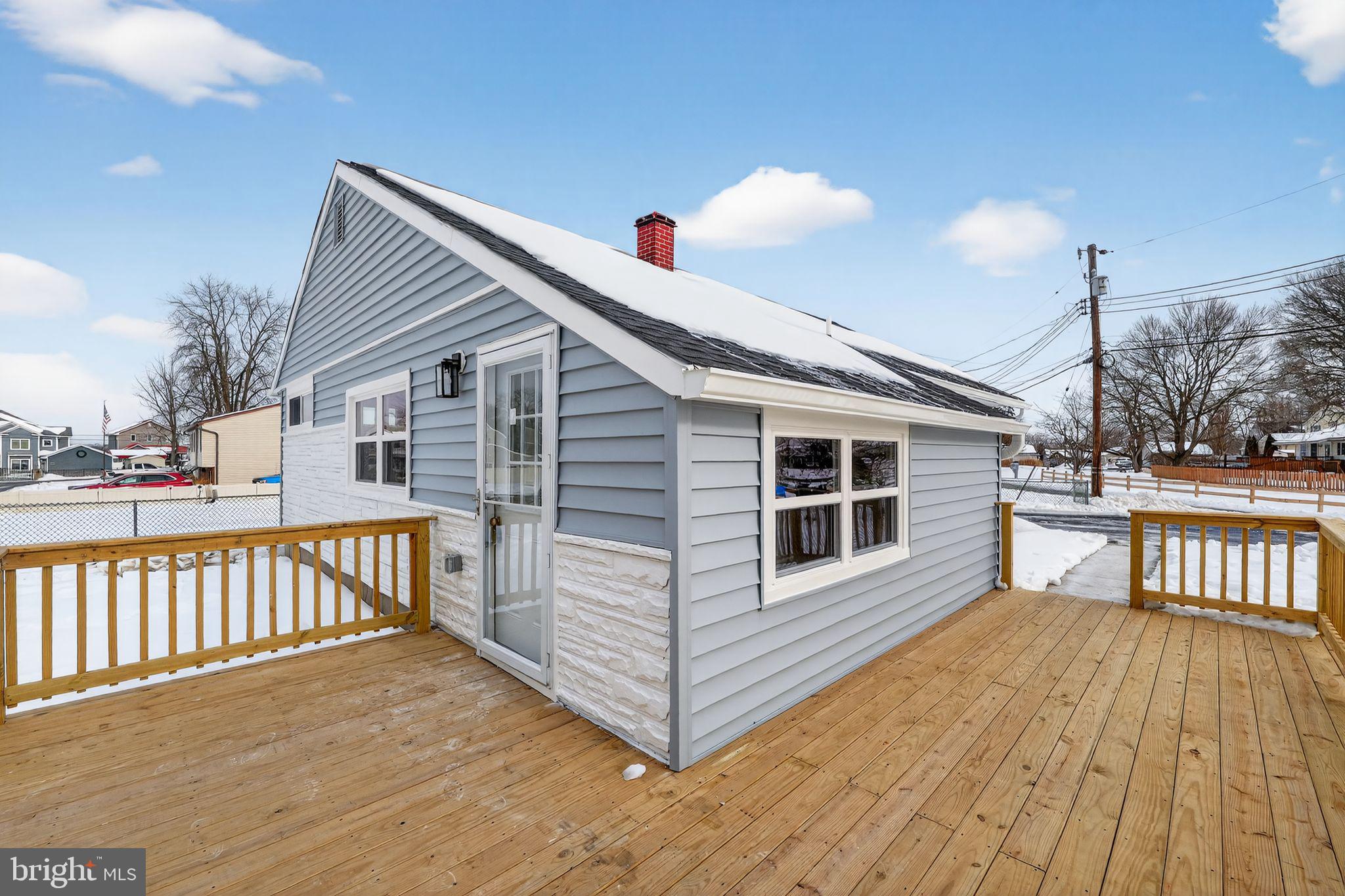 203 Antietam Road Baltimore, MD 21221 - Photo 2 of 33 a view of a house with wooden deck and a garden
