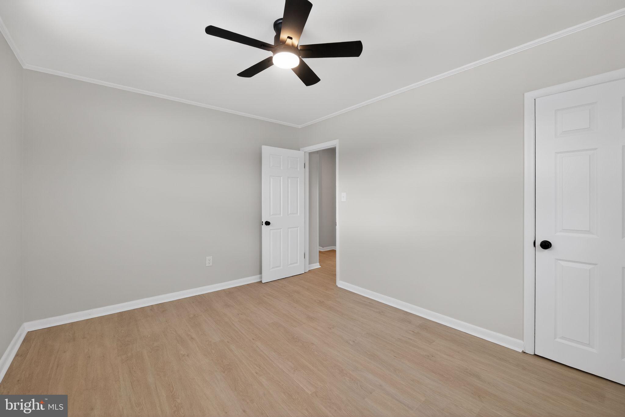 203 Antietam Road Baltimore, MD 21221 - Photo 21 of 33 wooden floor in an empty room