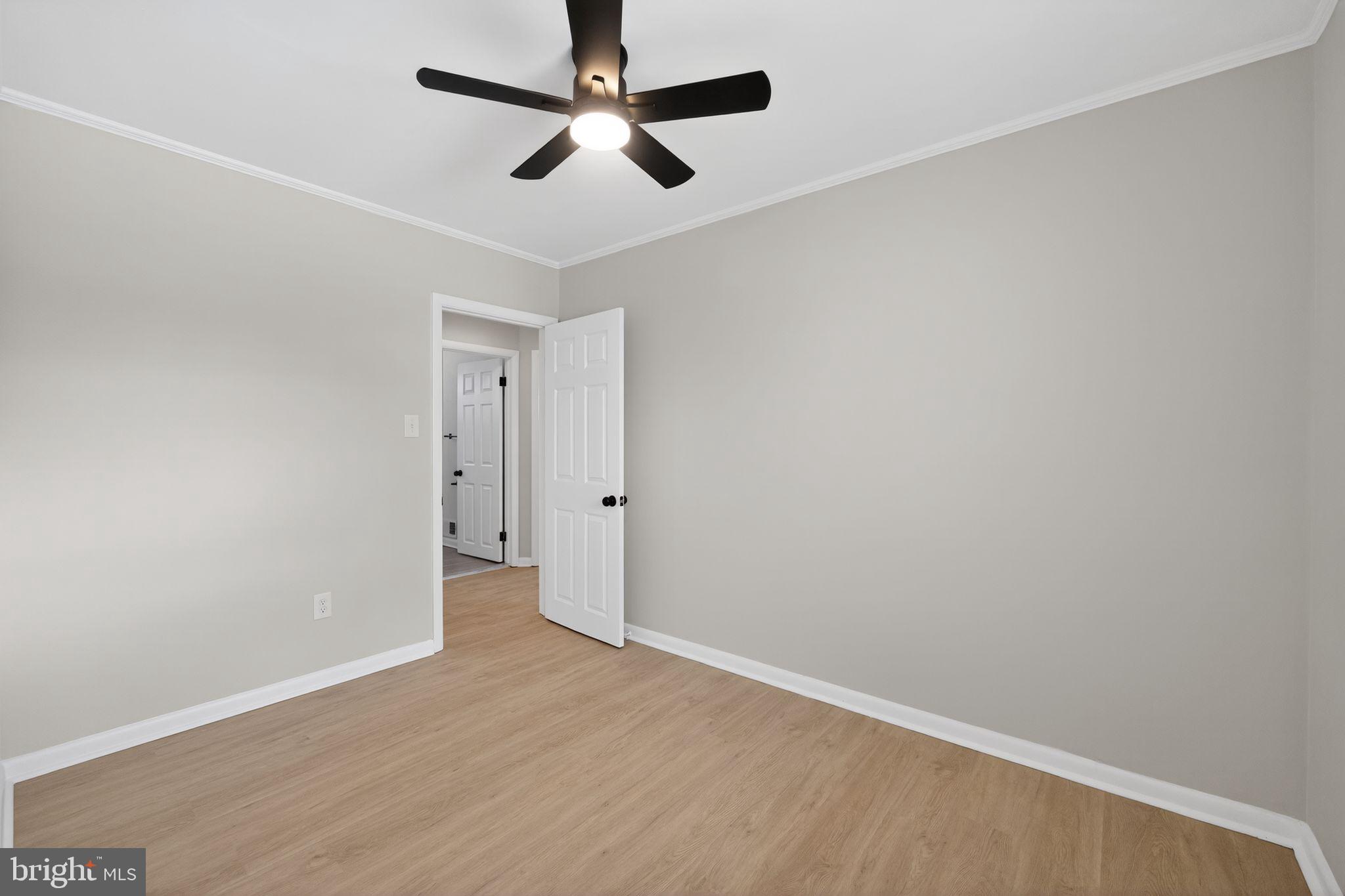 203 Antietam Road Baltimore, MD 21221 - Photo 22 of 33 wooden floor in an empty room