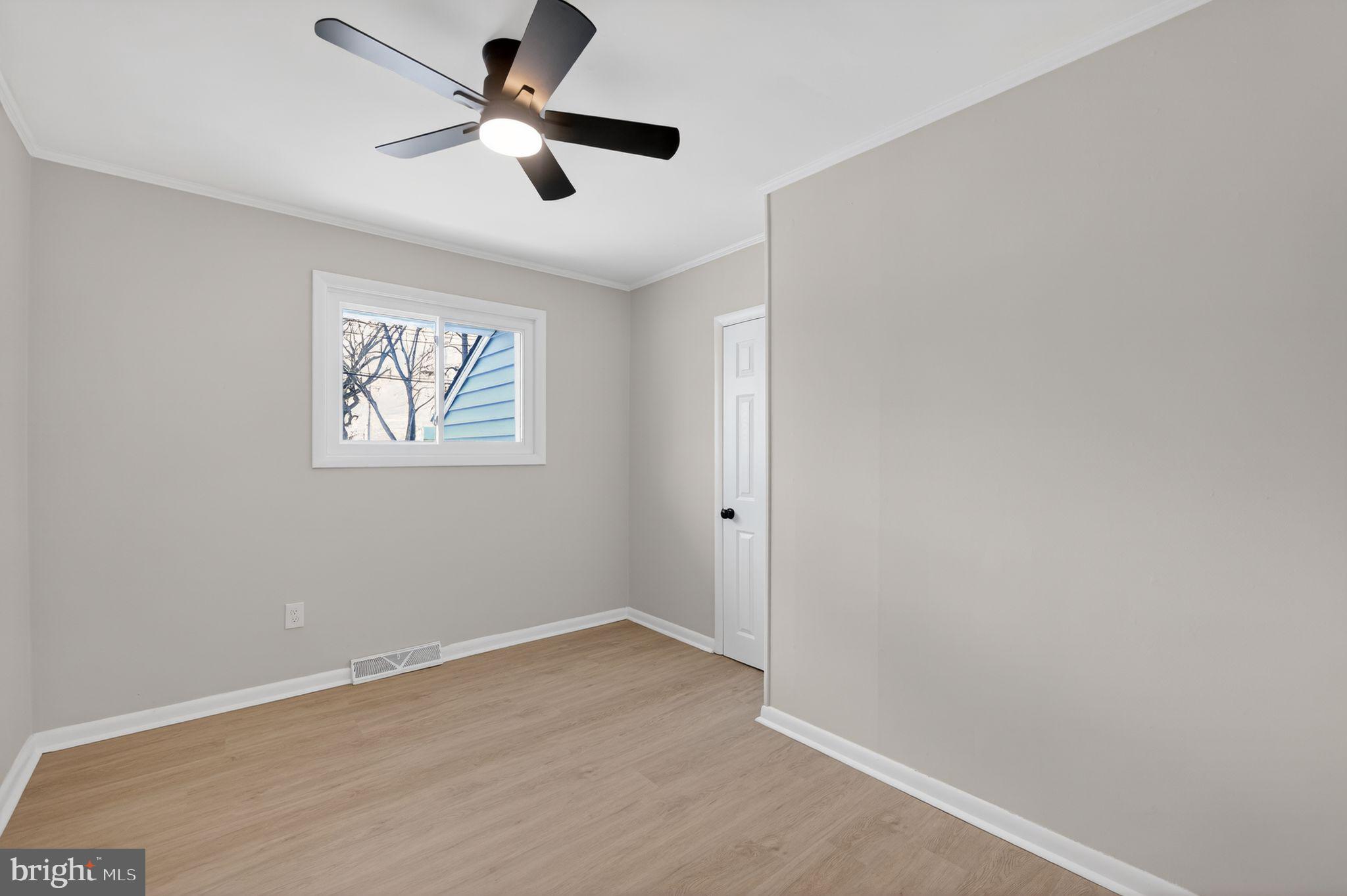 203 Antietam Road Baltimore, MD 21221 - Photo 28 of 33 wooden floor in an empty room