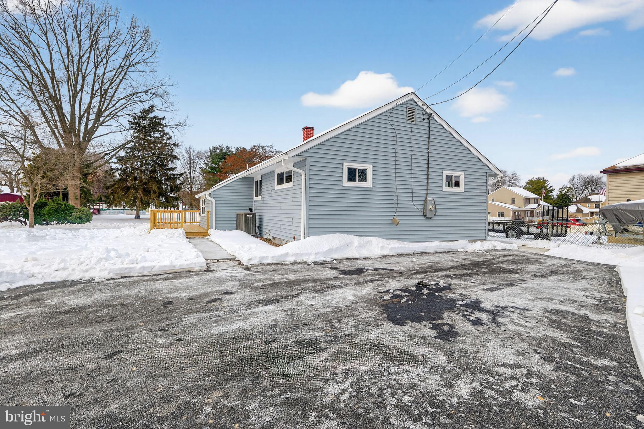 203 Antietam Road Baltimore, MD 21221 - Photo 3 of 33 a backyard of a house with large trees and outdoor space
