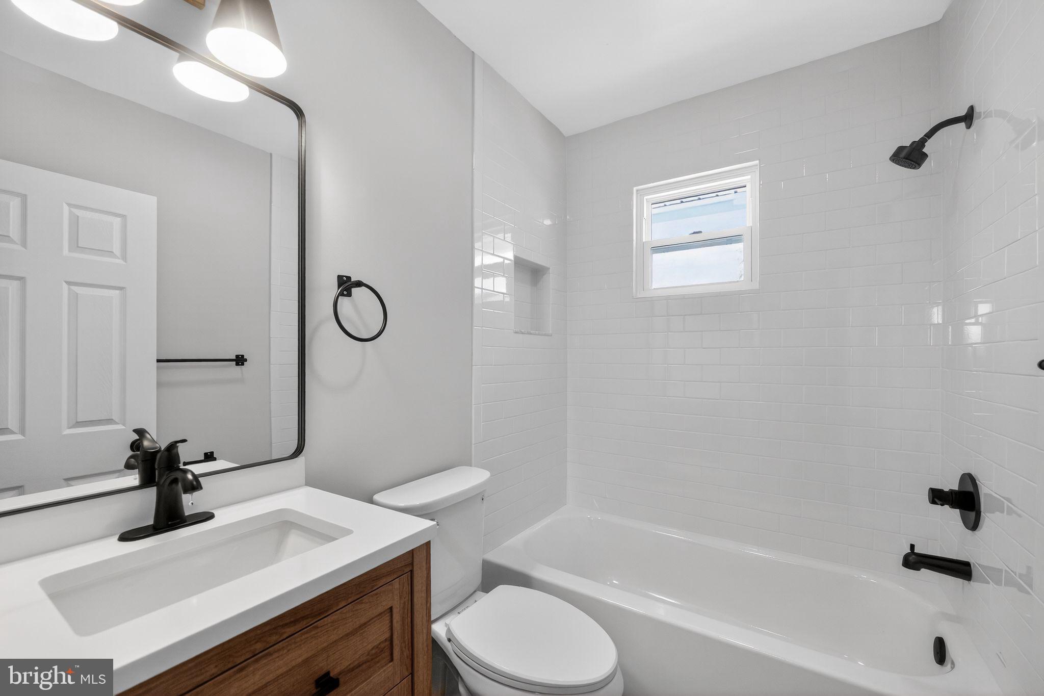 203 Antietam Road Baltimore, MD 21221 - Photo 33 of 33 a bathroom with a sink toilet tub and shower