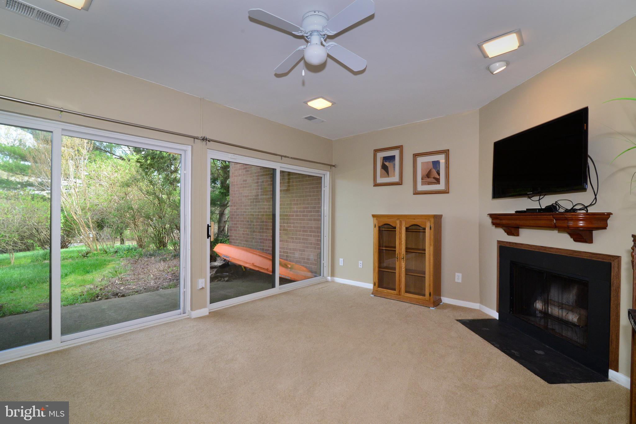 11086 Glade Court Reston, VA 20191 - Photo 36 of 44 Rec. room w/2 sliding glass doors & a fireplace!
