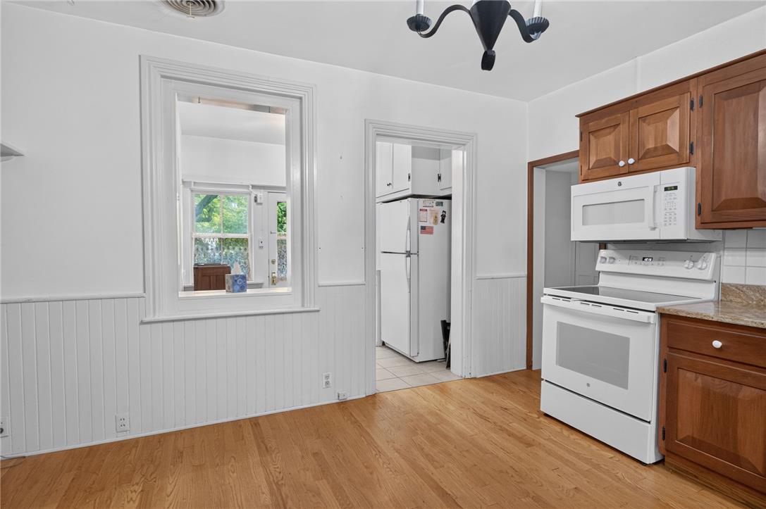 765 East Macada Road Bethlehem, PA 18017 - Photo 39 of 46 A well-appointed kitchen features rich hardwood flooring and a suite of essential appliances, ideal for culinary creations.