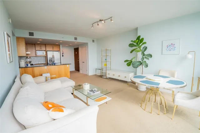 a living room with furniture and a table