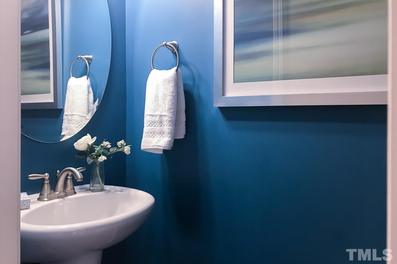 2901 Red Grape Drive Raleigh, NC 27607 - Photo 11 of 43 a bathroom with a sink and a mirror