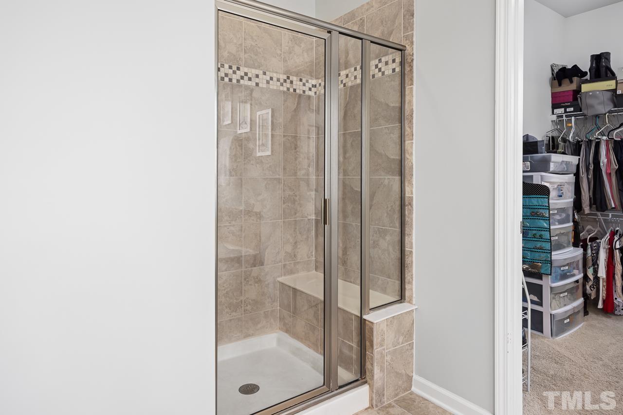 2901 Red Grape Drive Raleigh, NC 27607 - Photo 17 of 43 a bathroom with a glass shower door