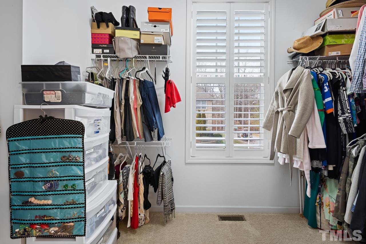 2901 Red Grape Drive Raleigh, NC 27607 - Photo 19 of 43 a view of walk in closet with clothes and shoes