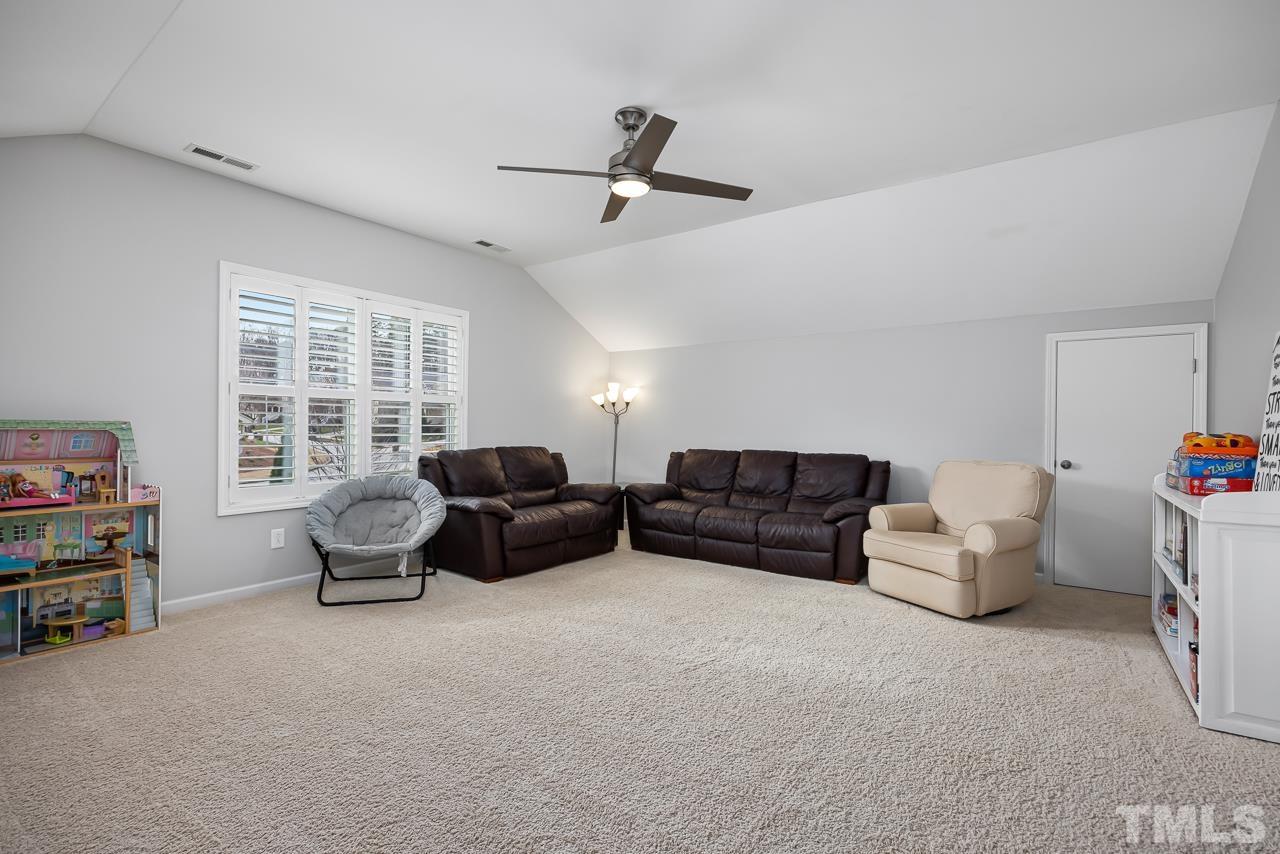 2901 Red Grape Drive Raleigh, NC 27607 - Photo 20 of 43 a living room with furniture and a window