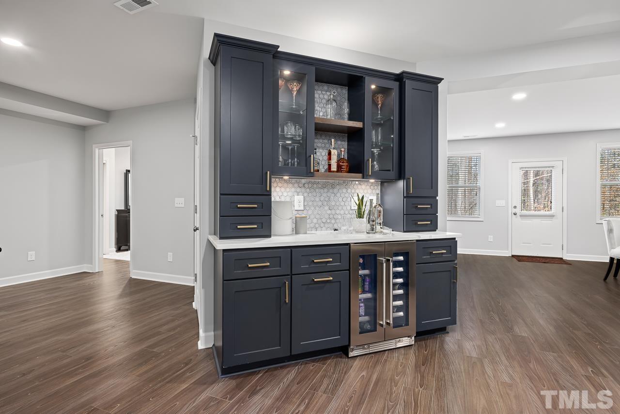 2901 Red Grape Drive Raleigh, NC 27607 - Photo 28 of 43 a spacious bathroom with a granite countertop sink and a mirror