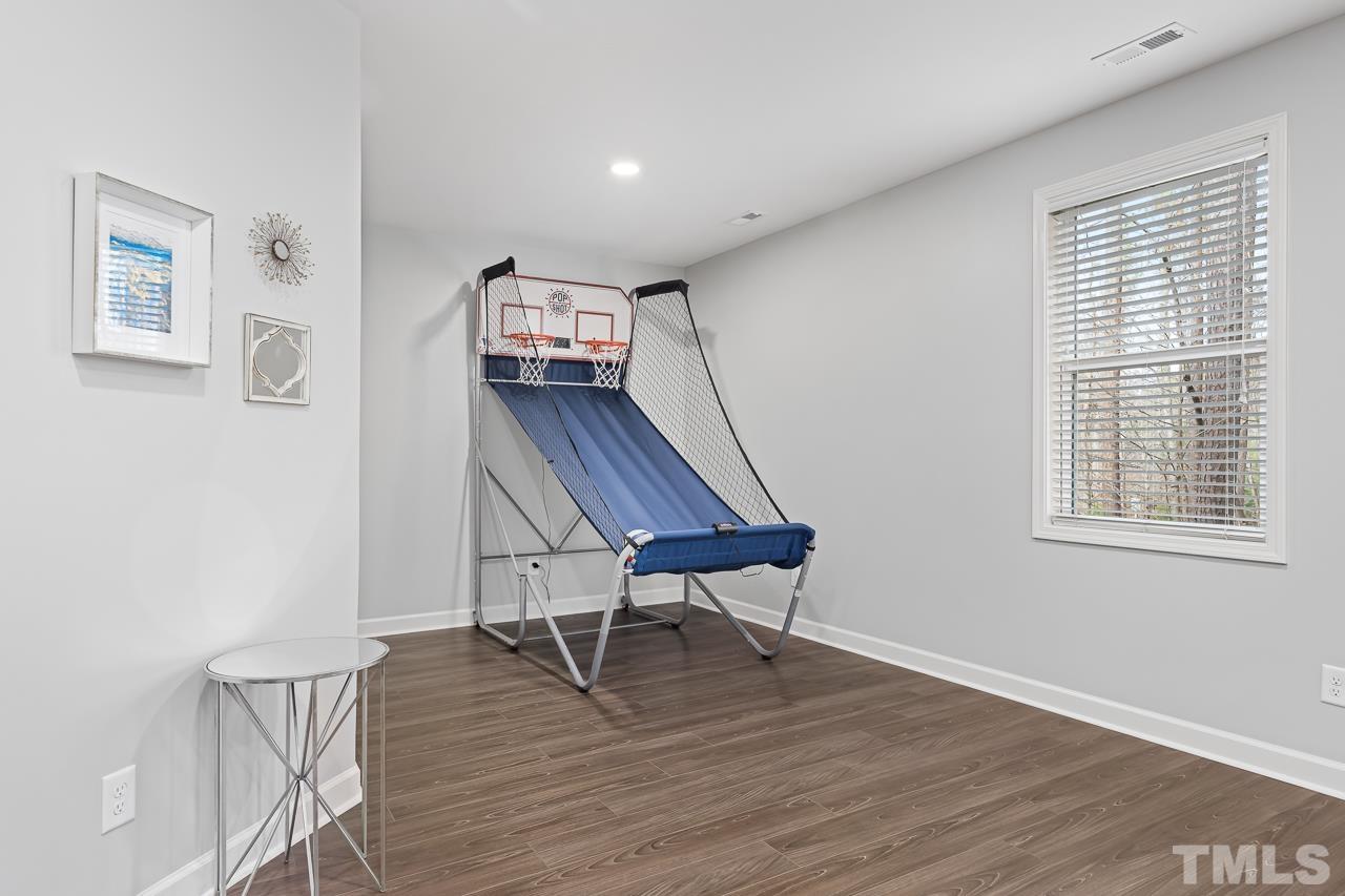 2901 Red Grape Drive Raleigh, NC 27607 - Photo 32 of 43 a living room with furniture and a wooden floor