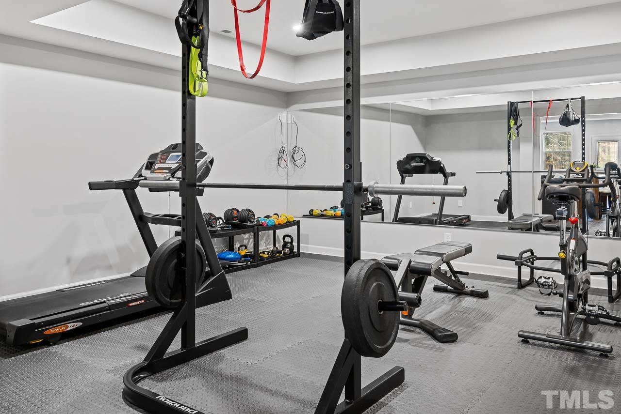 2901 Red Grape Drive Raleigh, NC 27607 - Photo 33 of 43 a view of a room with gym equipment