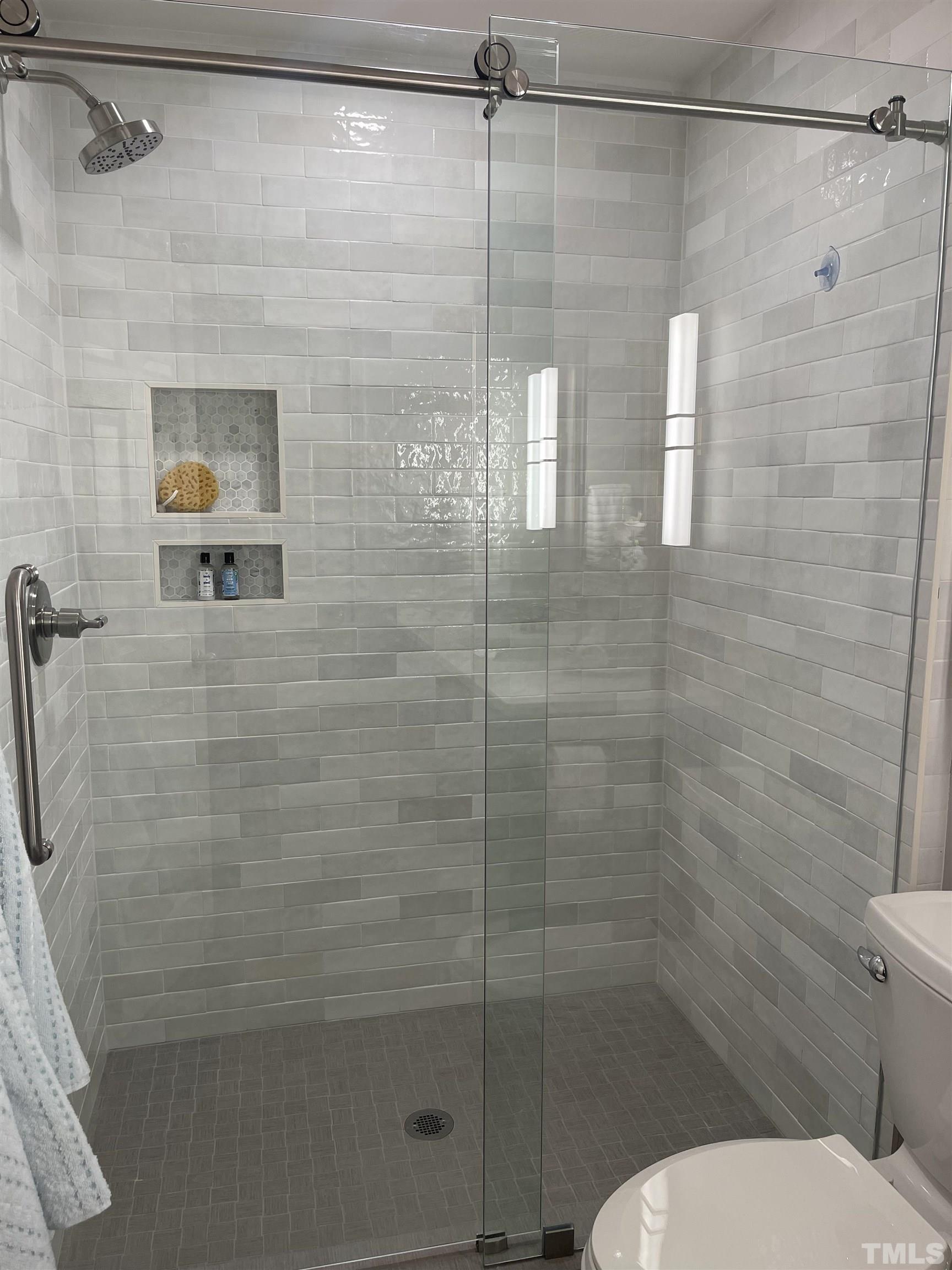 2901 Red Grape Drive Raleigh, NC 27607 - Photo 37 of 43 a bathroom with a shower and toilet