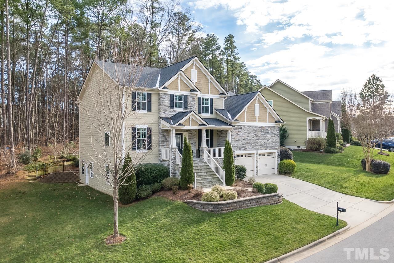 2901 Red Grape Drive Raleigh, NC 27607 - Photo 42 of 43 a front view of a house with a yard and porch