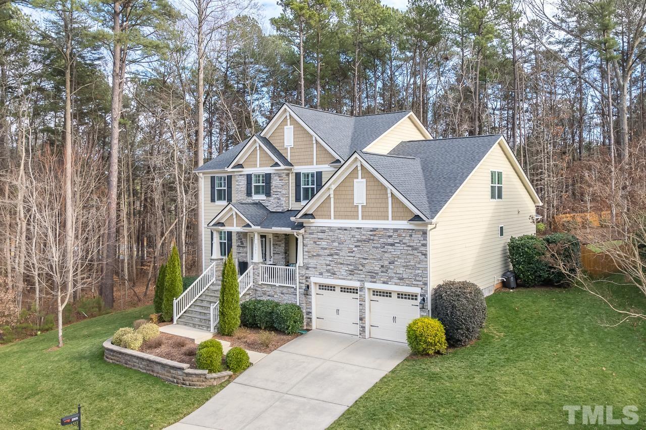 2901 Red Grape Drive Raleigh, NC 27607 - Photo 43 of 43 a front view of a house with a yard and garage